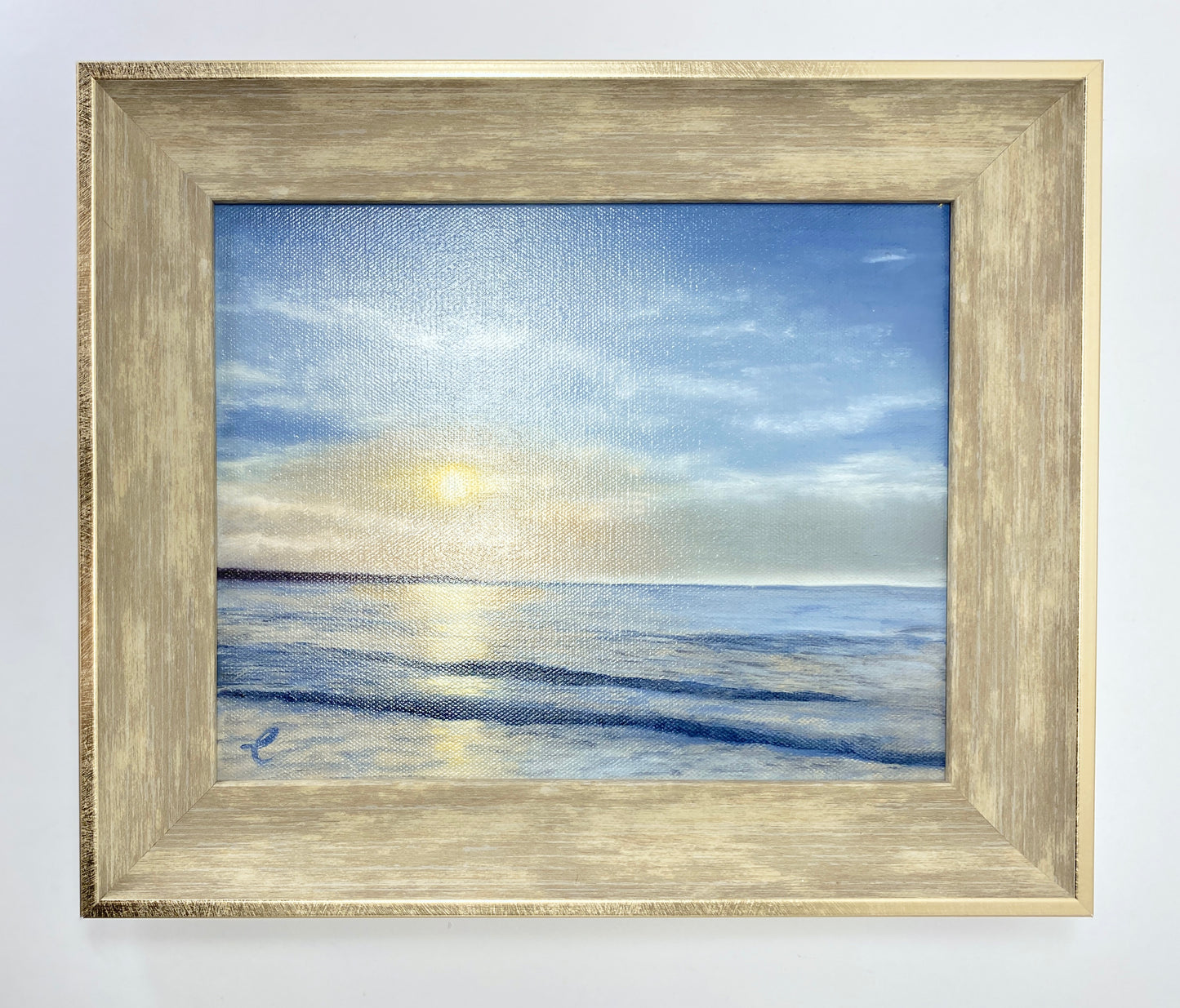 Framed painting of original oil painting of Narragansett Beach, RI with a blue sky and sun.