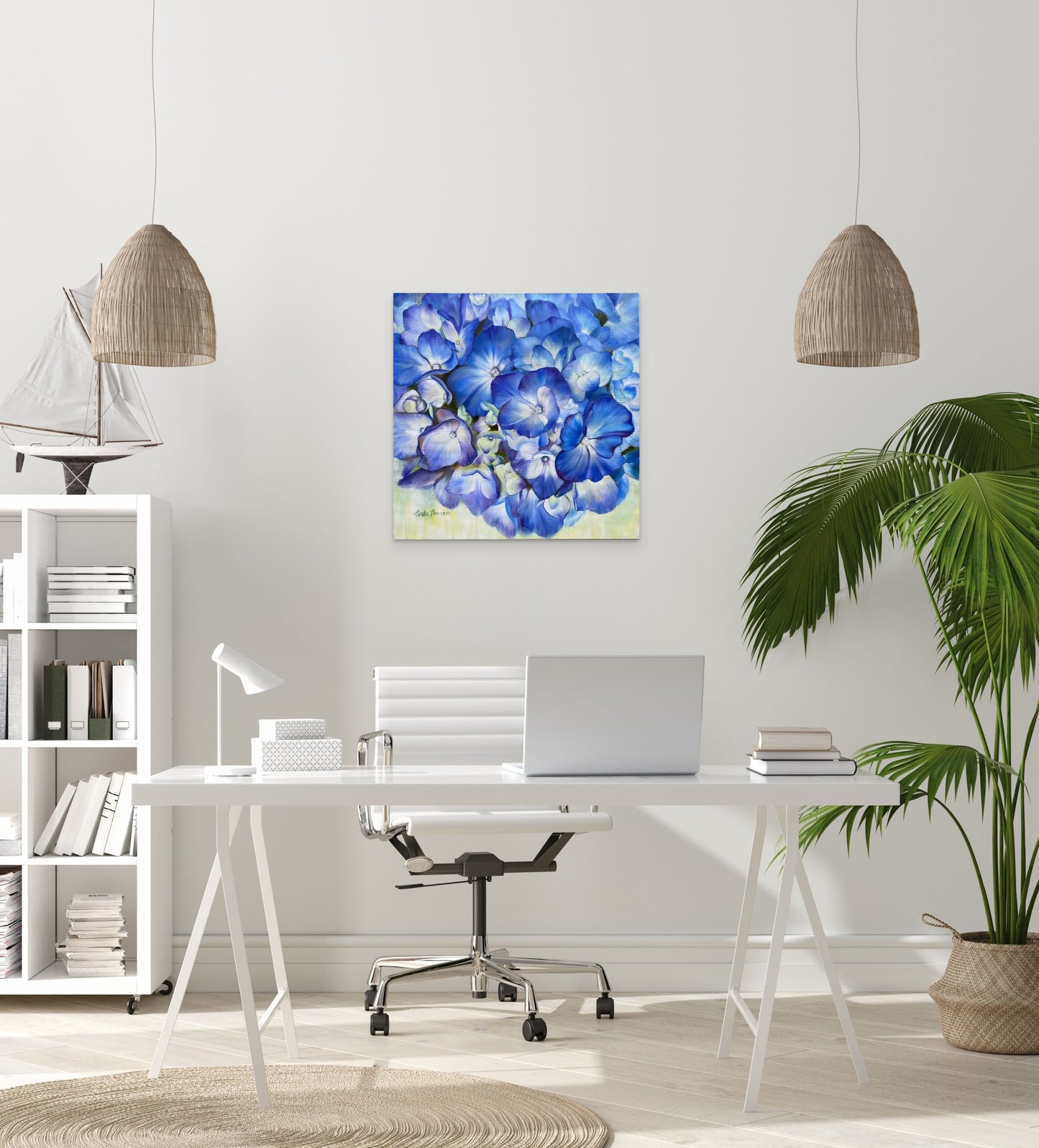 Modern office space with a desk, chair, and Echoes of Blue original oil painting on white wall behind desk.