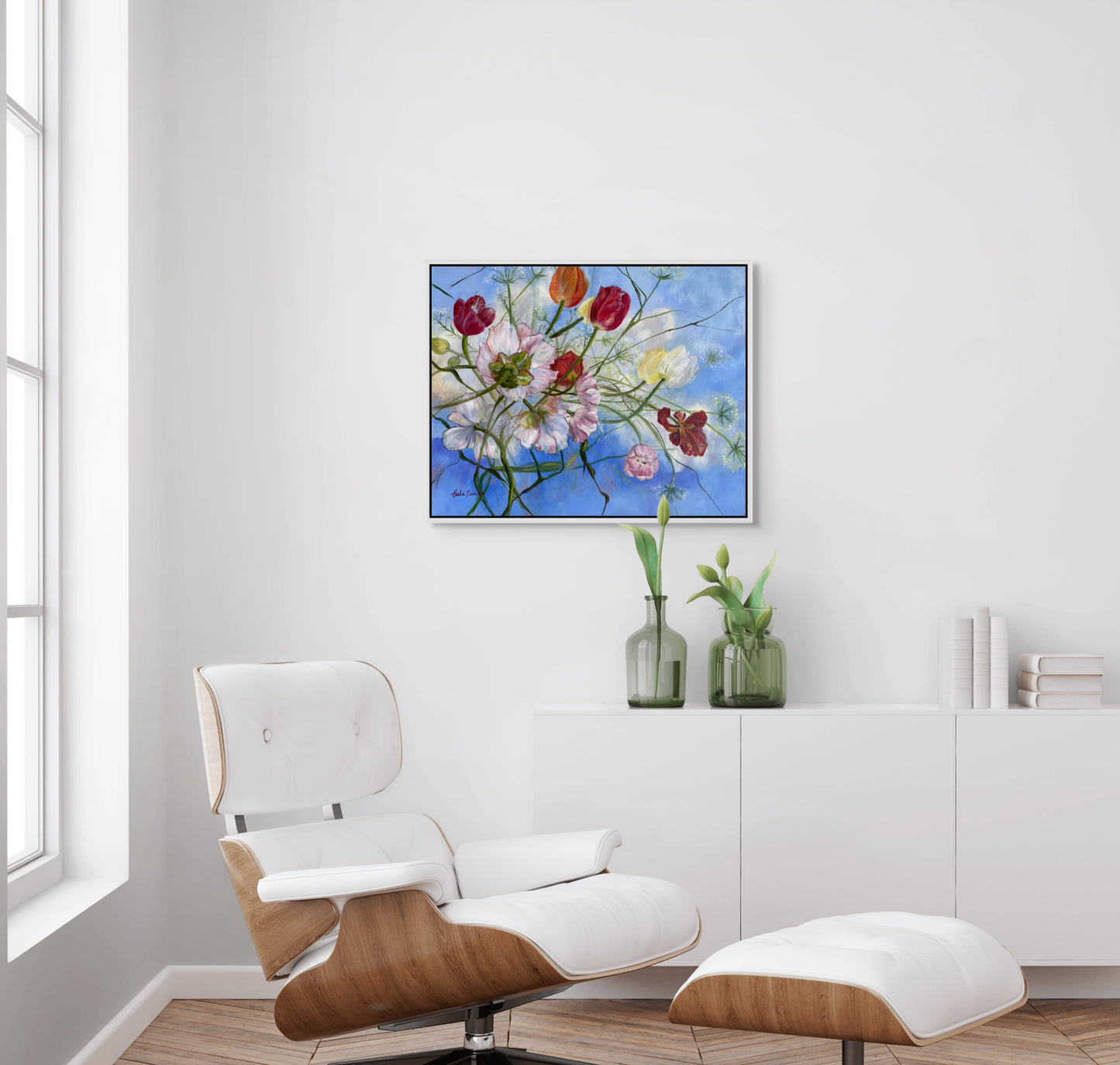 Wishful Thinking a colorful original floral oil painting in a Modern living room with a white armchair,and ottoman.
