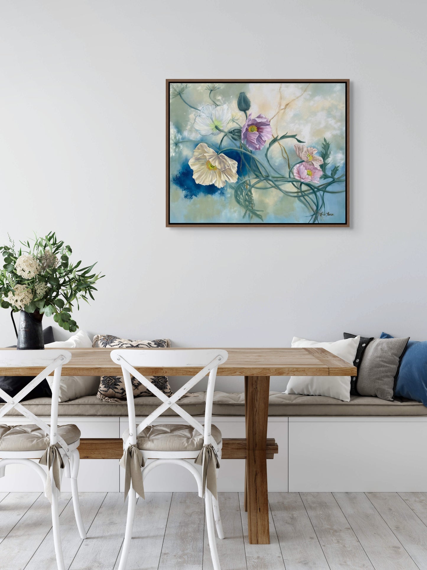 Dining room with wooden table, white chairs, and original floral oil painting Tangled Reverie on the wall.