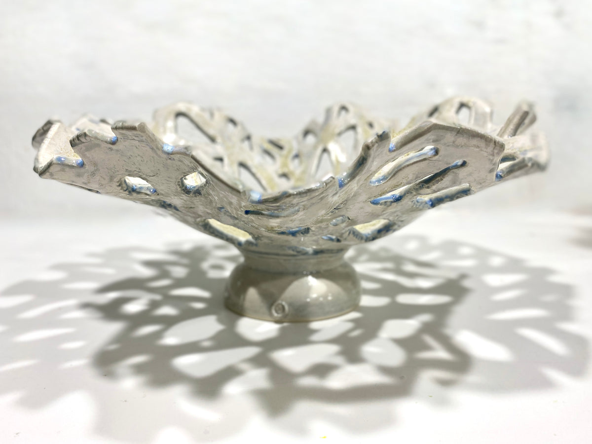 Openwork: Coastal — Reef, side profile showing elevated footed base, bleached white rim and warm gold center glaze
