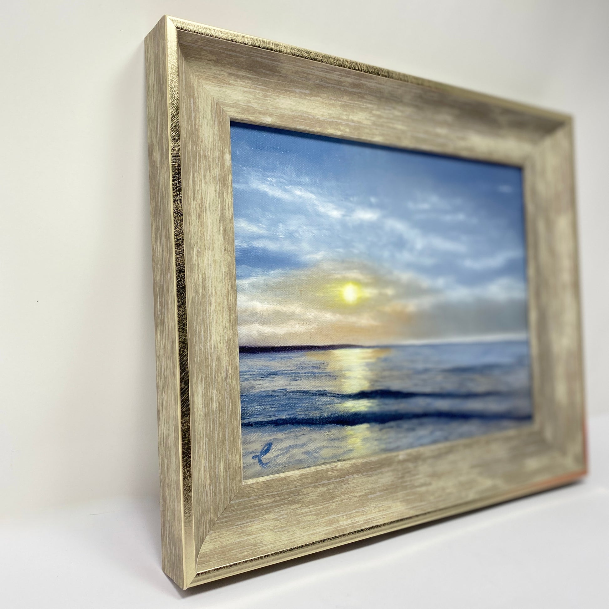 Framed artwork of a Narragansett Beach sunrise over water on a white background