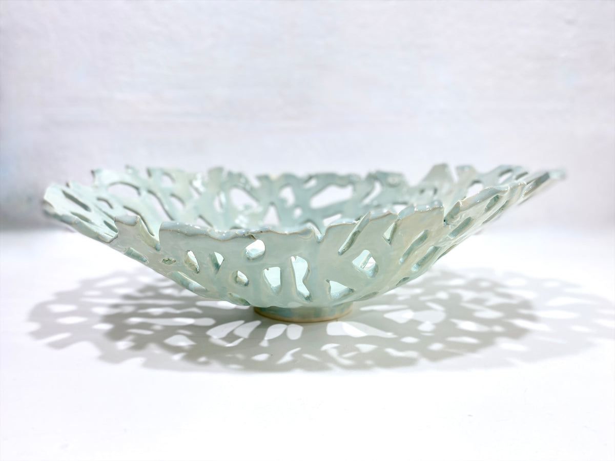 Openwork: Coastal — Seaglass, side profile on white background showing depth and irregular shoreline rim with even celadon glaze