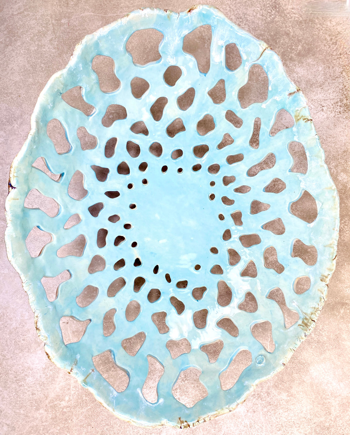 Openwork: Coastal — Tidepool, overhead view showing full openwork pattern with celadon pooling in the pierced gaps