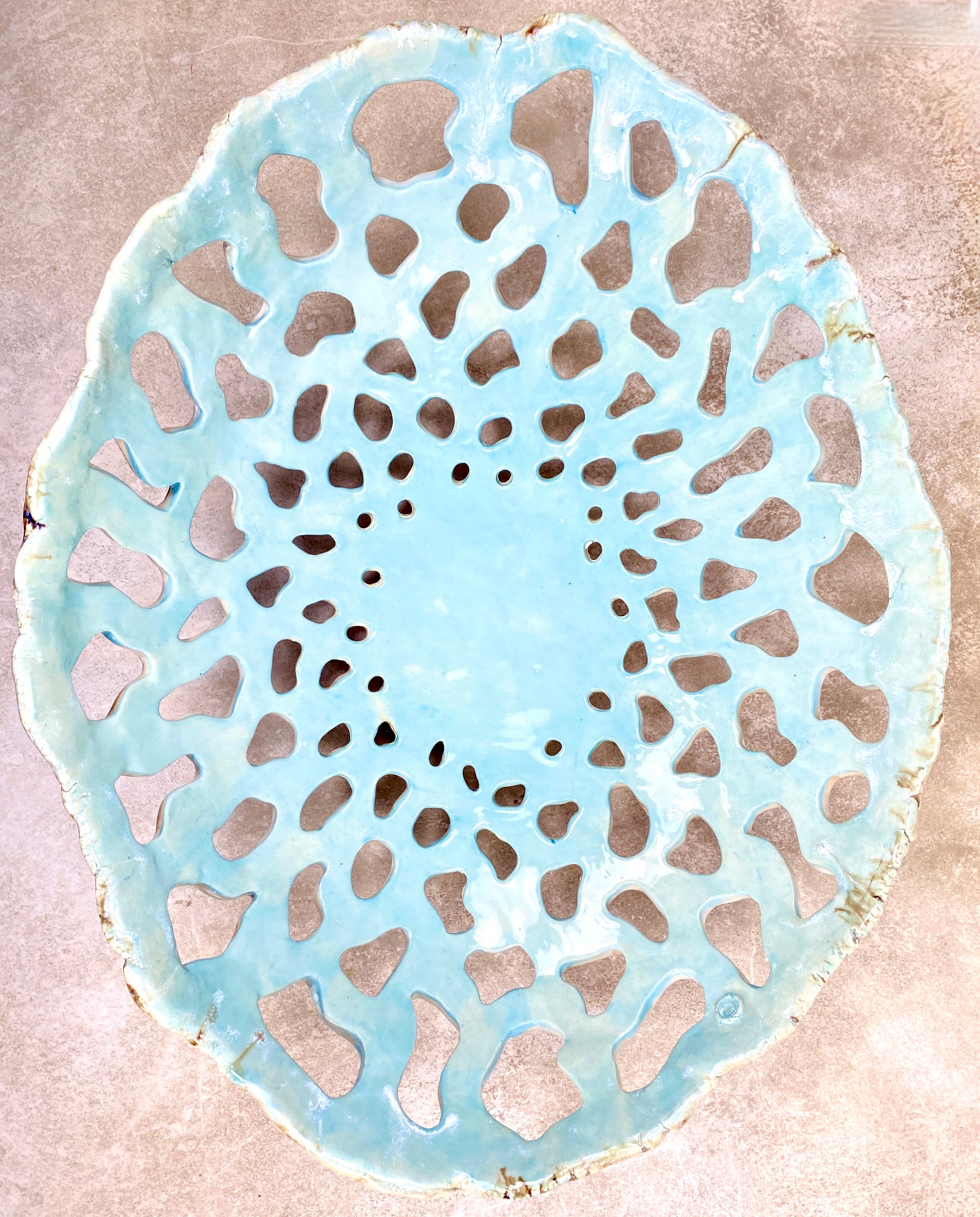 Openwork: Coastal — Tidepool, overhead view showing full openwork pattern with celadon pooling in the pierced gaps