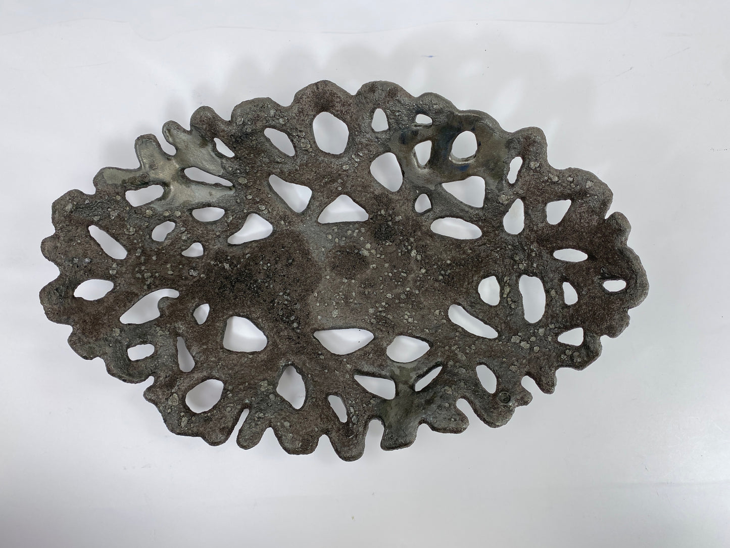 Openwork: Coastal — Nighttide, overhead view showing full openwork pattern and dark coastal glaze