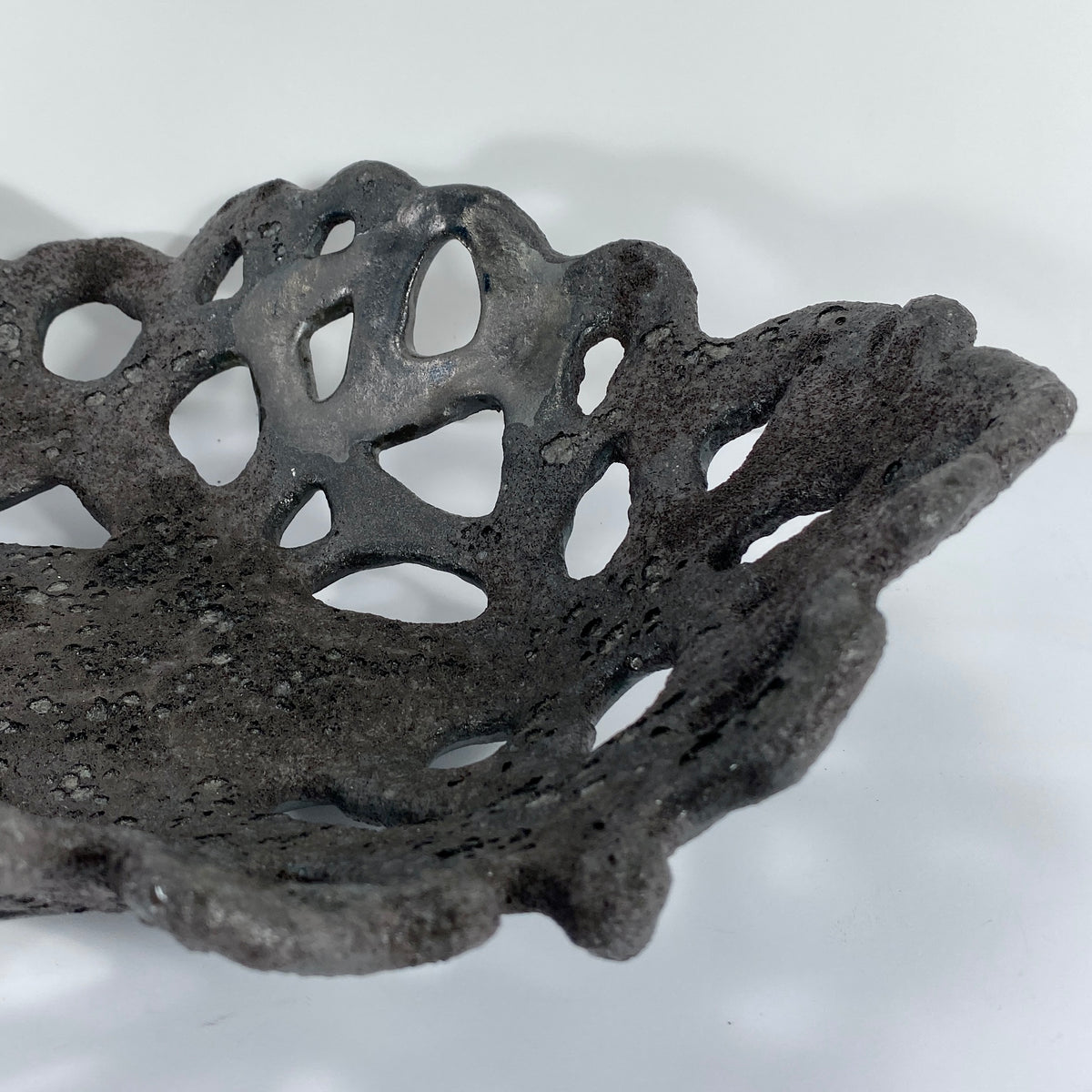 Openwork: Coastal — Nighttide, close-up detail of openwork rim showing hand-cut organic forms and matte texture