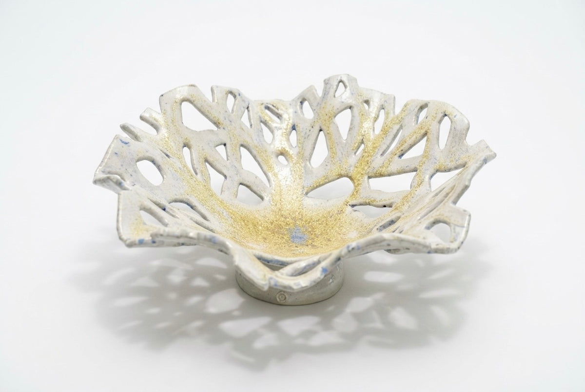 Openwork: Coastal — Reef on white background, three-quarter view showing wide low form and luminous crystal-shimmer glaze