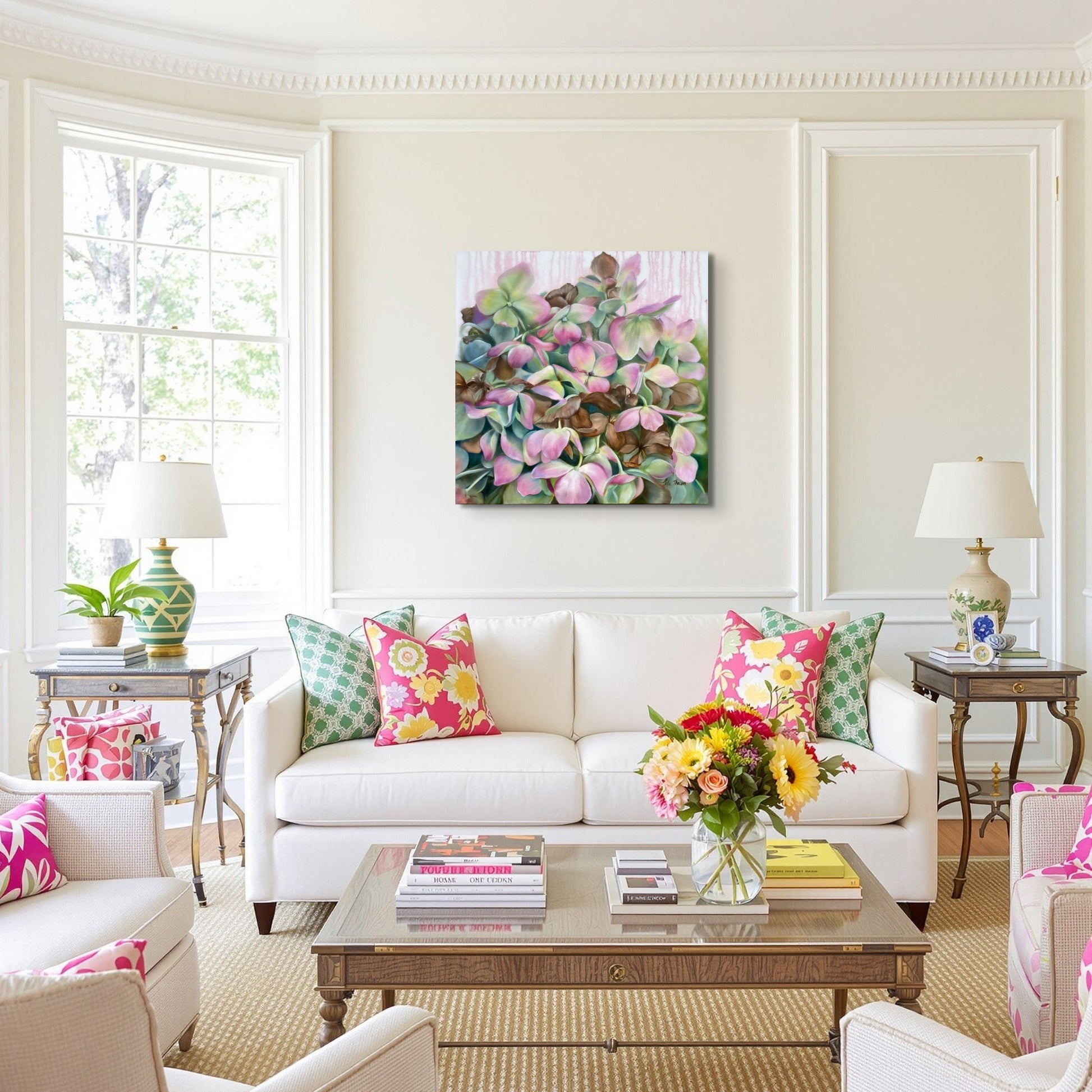 Living room with a white sofa, colorful pillows, and Whispers of TIme original floral oil painting on the wall.